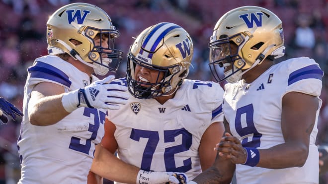 Washington center Parker Brailsford celebrates with his teammates. Photo | Washington Athletics 