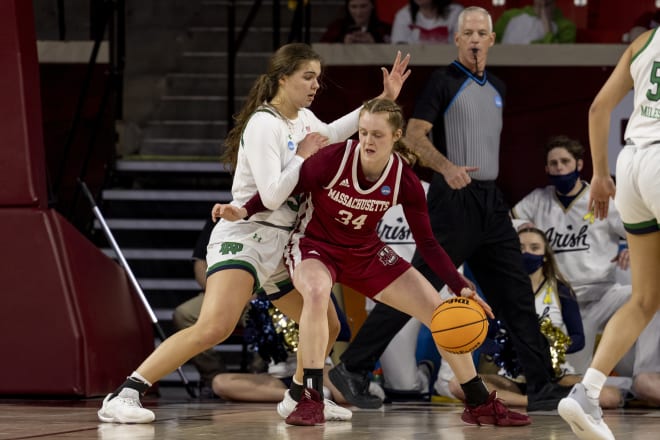 Notre Dame forward Maddy Westbeld, left, guards UMass forward Sam Breen in the first half of a first-round game in the NCAA women's basketball tournament, Saturday in Norman, Okla. 