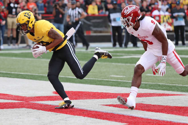 Taivon Jacobs (No. 12) catches a touchdown pass in last season's meeting with Indiana. 