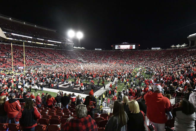 Louisville fans storm the field at L&N Stadium after the Cardinals upset 10th-ranked Notre Dame on Saturday night.