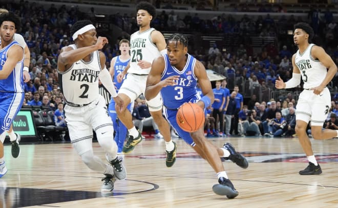 Michigan State guard Tyson Walker defends Duke guard Jeremy Roach in Chicago on Nov. 14, 2023. 