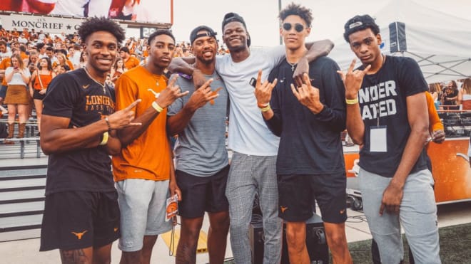 Brown (far right) during one of his many visits to Texas. (@TexasMBB)