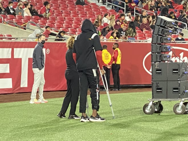 Michael Trigg stands with crutches late in the fourth quarter of USC's loss to Utah on Saturday night.