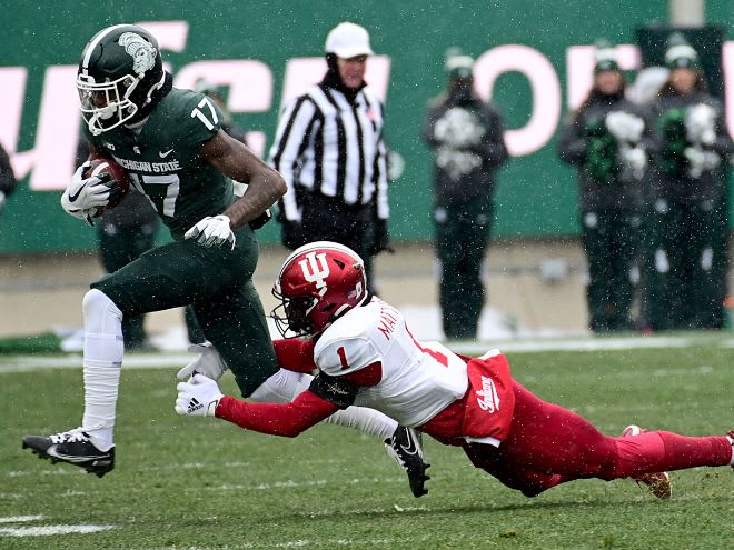 Michigan State wide receiver Tre Mosley runs the ball after a reception versus Indiana