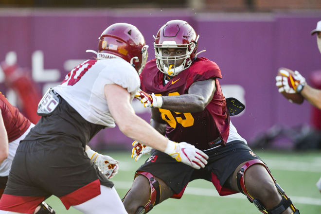 Freshman offensive lineman Casey Collier goes up against redshirt senior defensive end Connor Murphy on Monday.