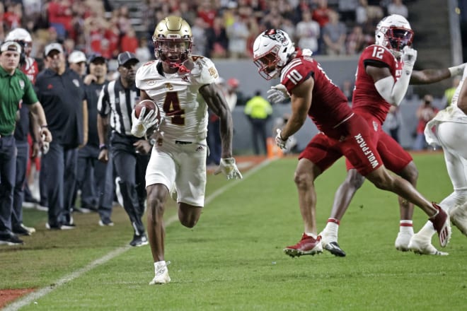 Boston College senior wide receiver Zay Flowers (4) run downs the sideline against North Carolina State on Nov. 12.