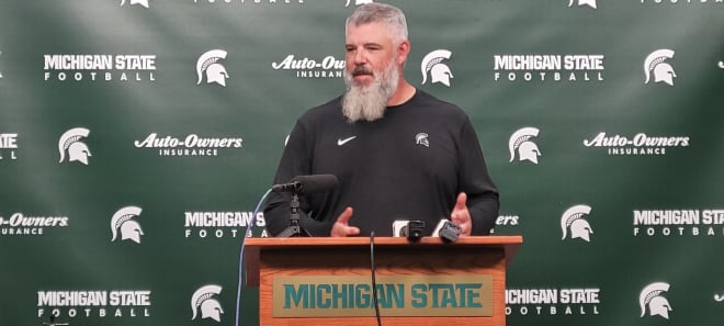 Michigan State defensive coordinator and linebackers coach speaking to the media,