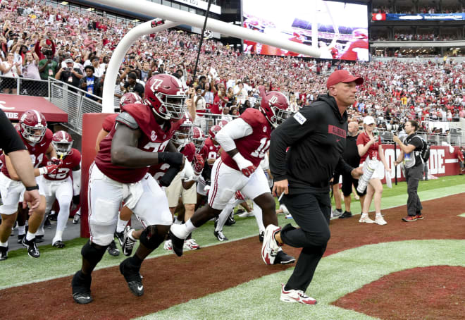 Alabama Crimson Tide head coach Kalen DeBoer leads his players onto the field at Bryant-Denny Stadium for his first game as head coach. The Crimson Tide played Western Kentucky Hilltoppers. | Credit: Gary Cosby Jr.-Imagn Images