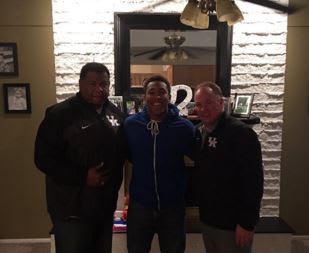 Snell with Mark Stoops and Vince Marrow during an in-home visit