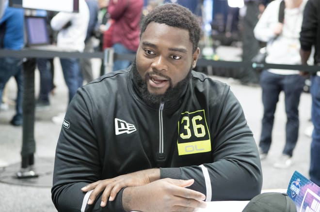 Michigan Wolverines football offensive lineman Michael Onwenu was drafted by the New England Patriots in the sixth round of the 2020 NFL Draft.