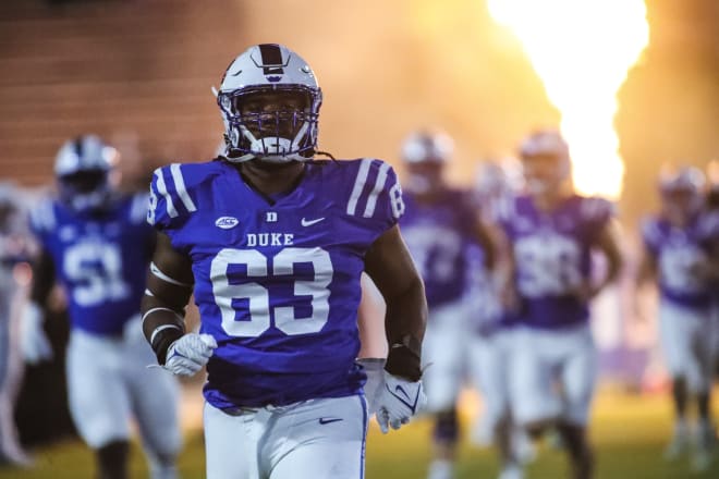 Jacob Monk jogs onto the field before last season's game against Louisville. 