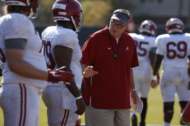 Alabama offensive line coach Doug Marrone instructs players during practice. Photo | Alabama Athletics 