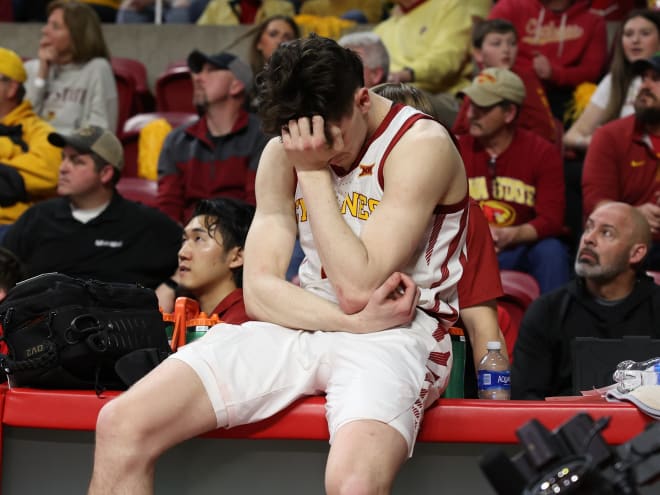 Caleb Grill sits on the scorers table in the moments following what turned out to be his final game as a Cyclone Monday night.