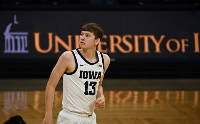 Austin Ash is back with the Hawkeyes and he's on scholarship.