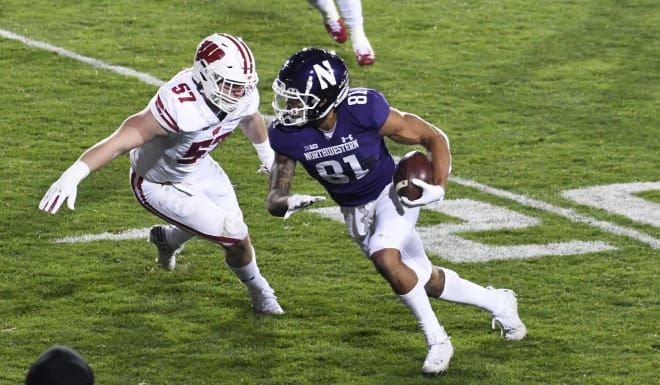 Northwestern Wildcats wide receiver Ramaud Chiaokhiao-Bowman (81) runs as Wisconsin Badgers linebacker Jack Sanborn (57) defends during the second half at Ryan Field. Mandatory Credit: David Banks-USA TODAY Sports