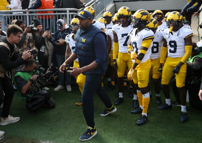 Nov 11, 2023; University Park, Pennsylvania, USA; Michigan Wolverines offensive lines coach Sherrone Moore leads the team onto the field before a game against the Penn State Nittany Lions at Beaver Stadium. Mandatory Credit: Matthew O'Haren-USA TODAY Sports