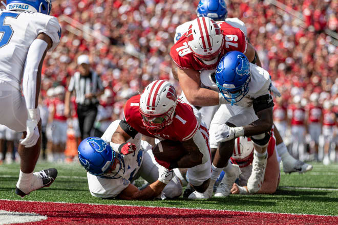 Wisconsin tailback Chez Mellusi scores the Badgers' first touchdown of the season. 