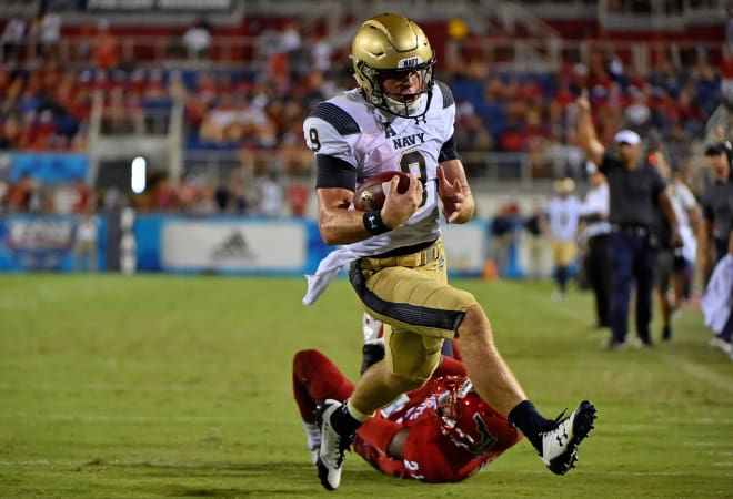 Midshipmen quarterback Zach Abey (9) runs the ball in for a touchdown against the Florida Atlantic Owls during the second half at FAU Football Stadium. 