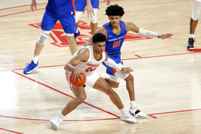 Houston guard Quentin Grimes (24) looks to drive around Boise State guard RayJ Dennis (10) during the first half of an NCAA college basketball game Friday, Nov. 27, 2020, in Houston. (AP Photo/Michael Wyke)
