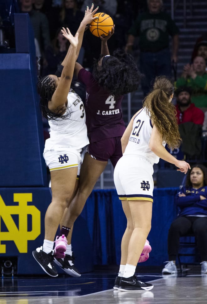 Notre Dame's Lauren Ebo, left, blocks a shot by Mississippi State's Jessika Carter in the final minute of an Irish victory.