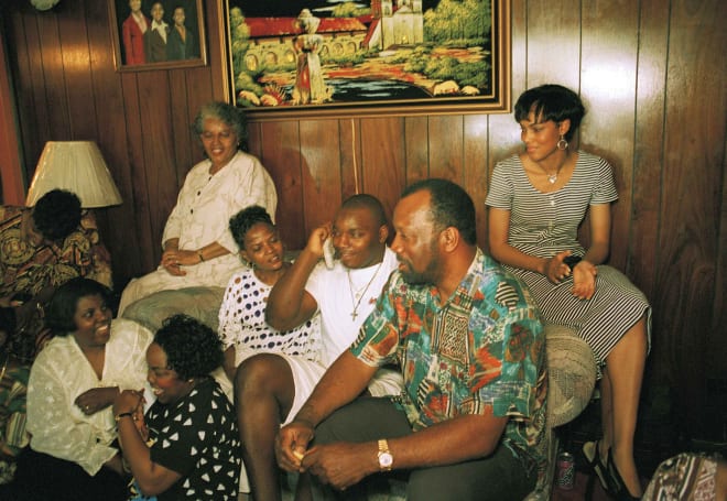 Former Notre Dame All-American Bryant Young is surrounded by family members as he finds out he has been drafted in the first round by the San Francisco 49ers on April 24, 1994.