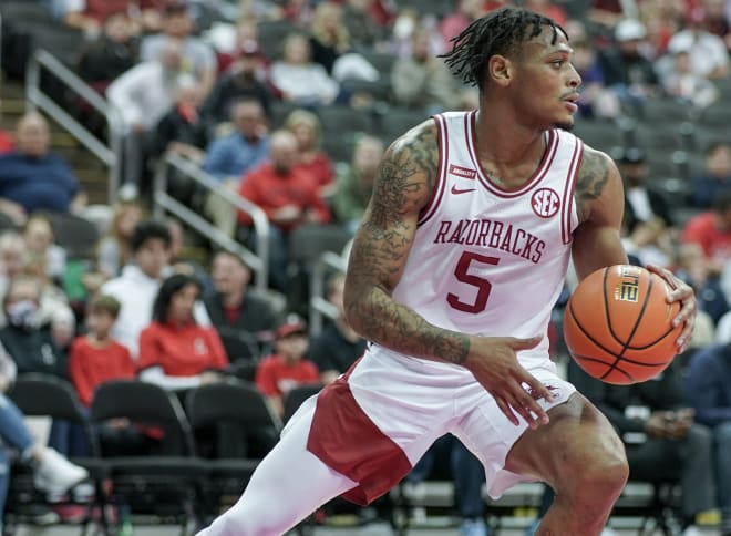 Arkansas guard Au'Diese Toney handles the ball in a win over Cincinnati on Nov. 24. Toney scored a team-high 19 points in Saturday's win over West Virginia.