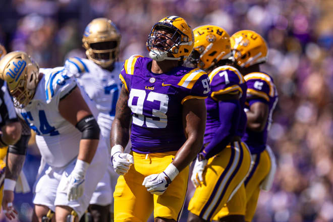 LSU Tigers defensive tackle Ahmad Breaux (93) reacts after sacking UCLA Bruins quarterback Ethan Garbers during the first half at Tiger Stadium.