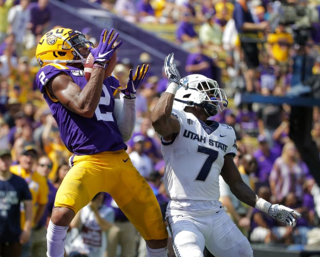 LSU's Justin Jefferson hauls in a 39-yard TD pass from Joe Burrow in the Tigers' 42-6 victory over Utah State 