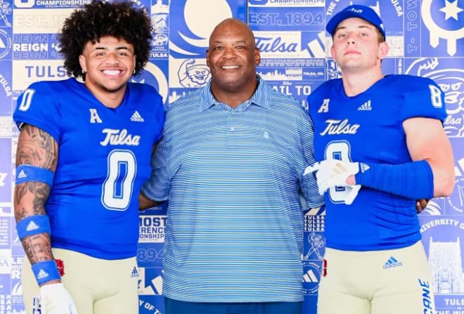 Titus Roberson (left) and Blake Isbell (right) with Tulsa defensive line coach Ron Burton.