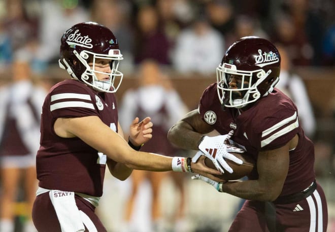 Mississippi State QB Will Rogers (2) hands off RB Jo'Quavious Davis (7) during the first half of the Egg Bowl at Davis Wade Stadium.