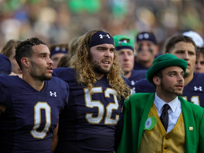 Linebacker Bo Bauer, middle, played in the first 56 games of his Notre Dame career. Saturday's game against Stanford will be the first he misses.