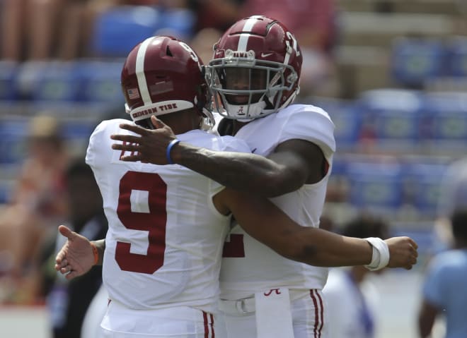 Alabama Crimson Tide quarterbacks Bryce Young (9) and Jalen Milroe (2) embrace during warm ups before the game against the Florida Gators at Ben Hill Griffin Stadium. Photo | Gary Cosby-USA TODAY Sports
