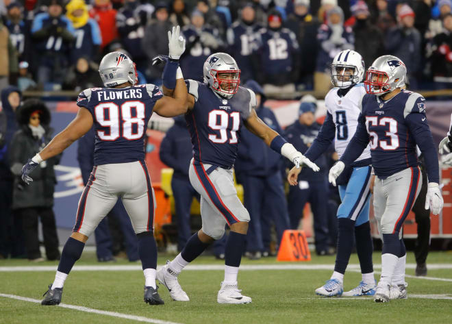 Trey Flowers and Deatrich Wise celebrate one of three combined sacks in their playoff victory over the Titans. 