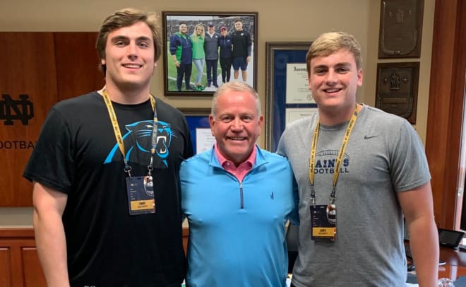 Tommy Brockermeyer (left) with Notre Dame head coach Brian Kelly and his brother James Brockermeyer