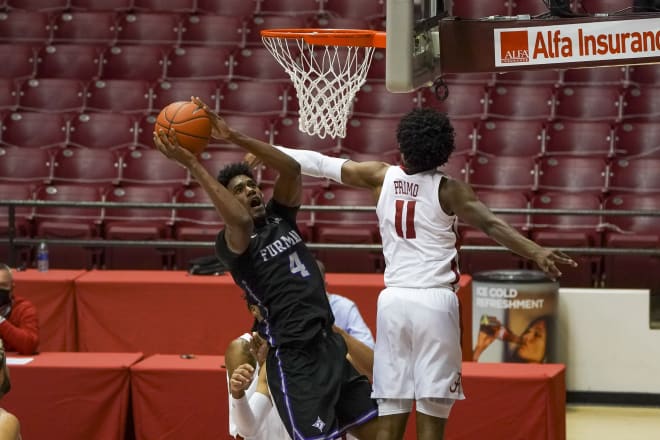 Furman Paladins forward Noah Gurley (4) shoots over Alabama Crimson Tide guard Joshua Primo (11) during the first half at Coleman Coliseum. Photo | USA Today