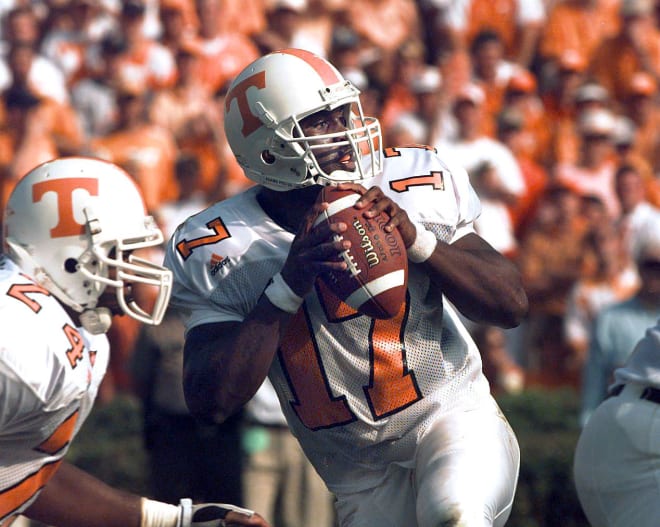 Tennessee quarterback Tee Martin falls back to pass just before he was hit hard and taken out of the game against Auburn for a couple of plays.