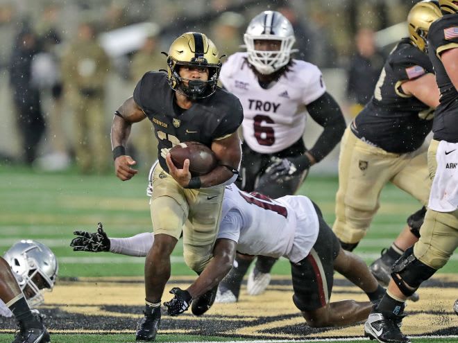Army RB Tyrell.Robinson hits the hole against the Troy Trojans defense during the 2nd half of Saturday's game