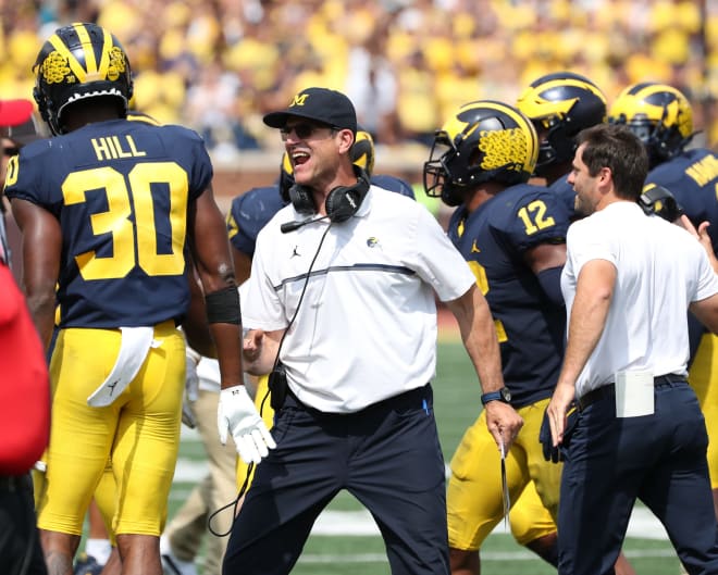 Michigan Wolverines football head coach Jim Harbaugh picked up his 50th career win at U-M Saturday.