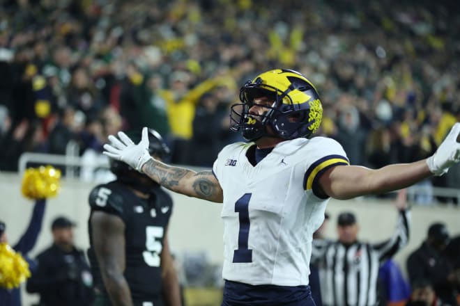 Michigan Wolverines wide receiver Roman Wilson (1) celebrates his touchdown against the Michigan State Spartans during first-half action at Spartan Stadium in East Lansing on Saturday, Oct. 21, 2023.