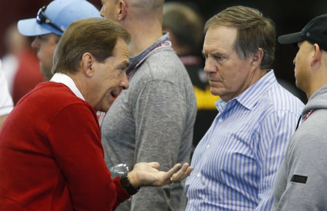 Alabama head coach Nick Saban talks with New England Patriots head coach Bill Belichick on Wednesday during the Crimson Tide's Pro Day.
