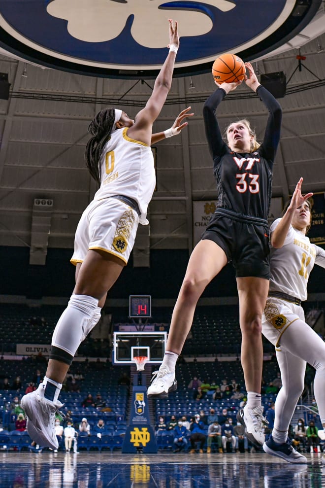 Virginia Tech center Elizabeth Kitley (33) shoots as Notre Dame's Maya Dodson (0) defends during ND's 68-55 victory Thursday night at Purcell Pavilion in South Bend, Ind.