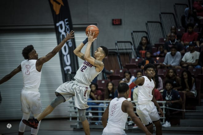 Jules Moor of Dawson shoots over Westfield's Jase Frebres. Moor finished with 29 points