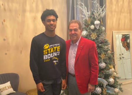 Earl Little Jr., with Nick Saban on Thursday evening.