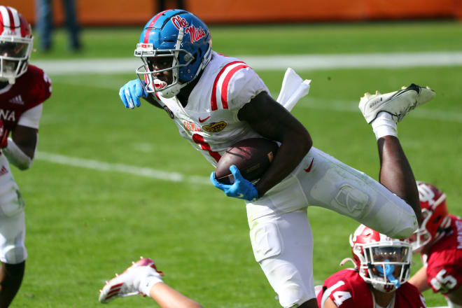 Ole Miss Rebels wide receiver Jonathan Mingo (1) runs with the ball against the Indiana Hoosiers during the first half at Raymond James Stadium. Mandatory Credit: Kim Klement-USA TODAY Sports