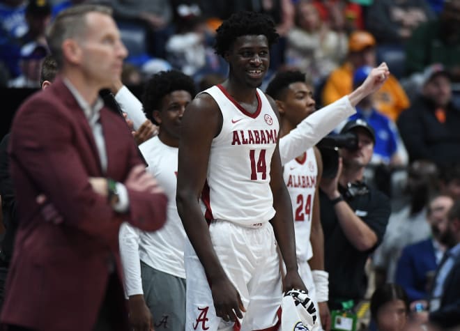 Alabama Crimson Tide center Charles Bediako (14) and teammates celebrate on the bench in the closing seconds of a win against the Mississippi State Bulldogs at Bridgestone Arena. Photo | Christopher Hanewinckel-USA TODAY Sports