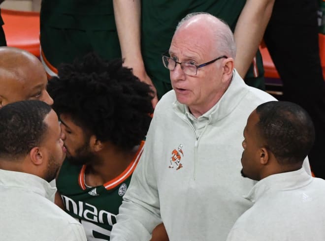 Miami coach Jim Larranaga, top, talks with coaches during a game against Clemson this season. 