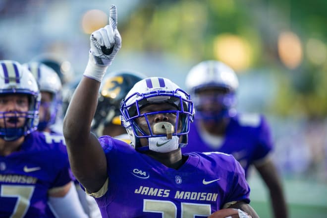 James Madison running back Cardon Johnson celebrates after scoring a touchdown during the Dukes' 52-10 win over East Tennessee State.