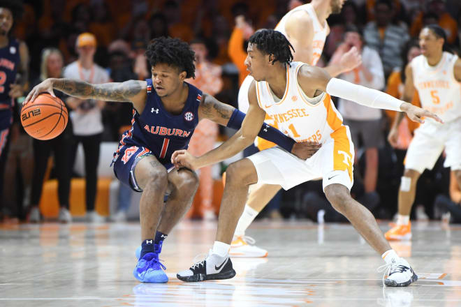 Auburn guard Wendell Green Jr. (1) is defended by Tennessee guard Kennedy Chandler (1) during the matchup between the Tigers and Volunteers at Thompson-Boling Arena in Knoxville.