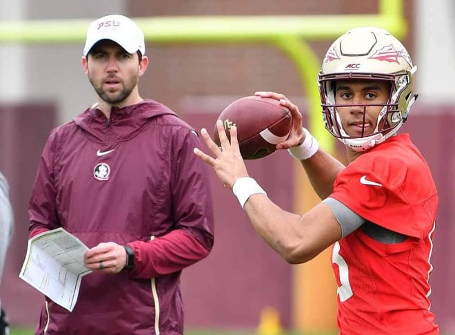 New offensive coordinator Kendal Briles watches QB Jordan Travis deliver a pass.