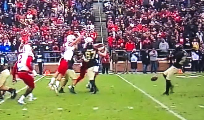 Pressure up the middle resulted in this first-half Purdue punt getting partially blocked.